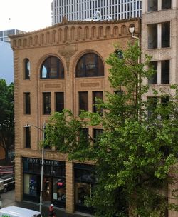 Built structure by trees in city