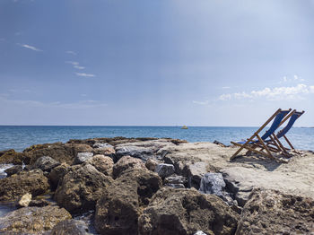 Deck chairs on a cliff