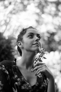 Portrait of young woman looking away