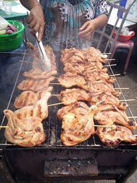 Close-up of meat cooking on barbecue grill