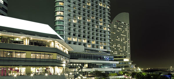 Modern skyscrapers in city at night