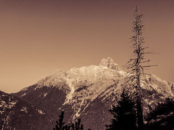 Scenic view of snowcapped mountains against clear sky