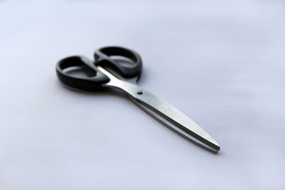 High angle view of metallic object against white background