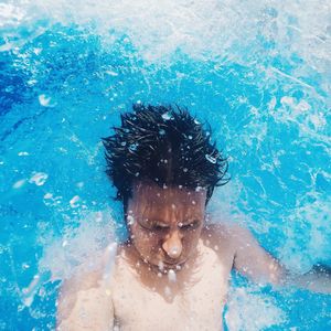 High angle view of man swimming in pool