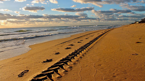 Scenic view of beach against sky