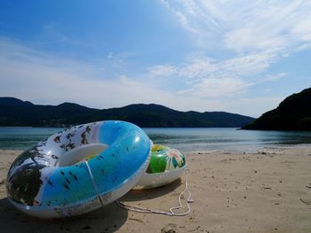 Panoramic view of beach against blue sky