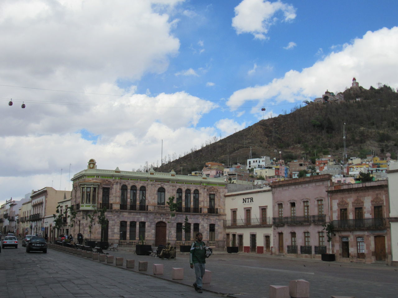 STREET BY BUILDINGS AGAINST SKY IN CITY