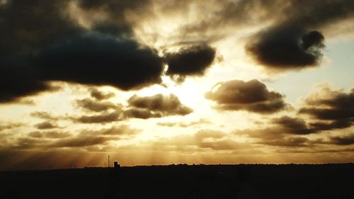 Scenic view of dramatic sky during sunset