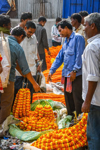 Group of people at market stall