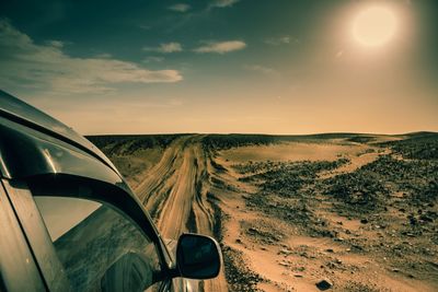 Scenic view of road against sky during sunset