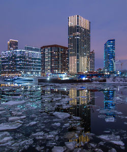 Illuminated buildings in city at night