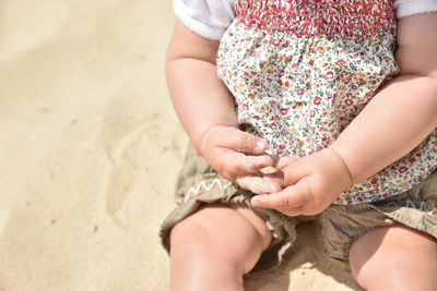 Baby girl on beach 