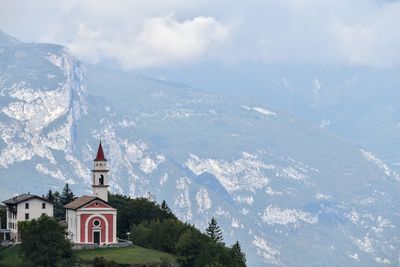 Panoramic view of building and mountains against sky