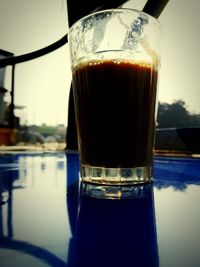 Close-up of beer glass on table