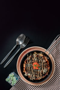High angle view of food against black background