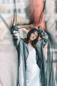 Full length portrait of woman standing in traditional clothing