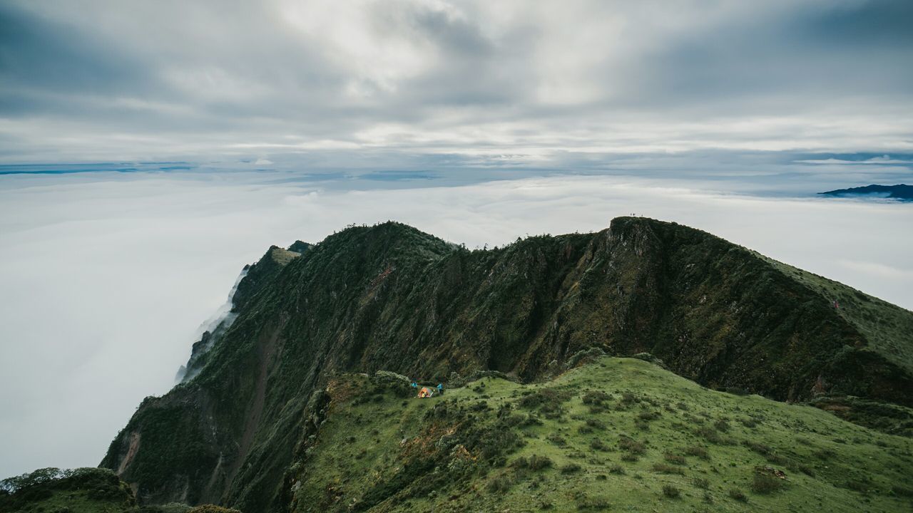 tranquil scene, scenics, sky, tranquility, mountain, beauty in nature, nature, cloud - sky, landscape, sea, cloud, non-urban scene, cloudy, idyllic, mountain range, rock formation, high angle view, day, remote, physical geography