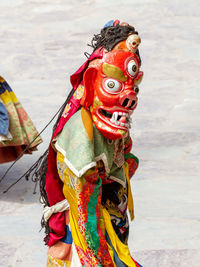 Close-up of multi colored statue on land