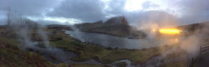 Panoramic view of waterfall against sky