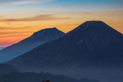 Scenic view of mountains against sky during sunset