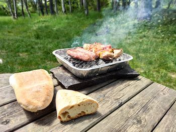 High angle view of meat on barbecue grill