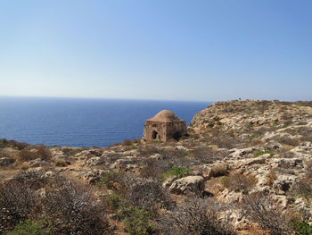 Scenic view of sea against clear blue sky