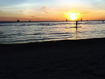Scenic view of sea at sunset