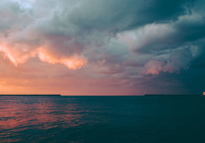 Scenic view of sea against sky at sunset