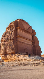 View of rock formation against clear blue sky