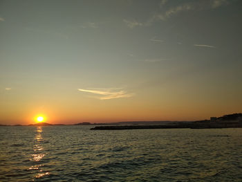 Scenic view of sea against sky during sunset