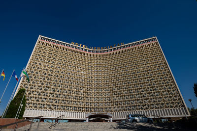 Low angle view of building against blue sky