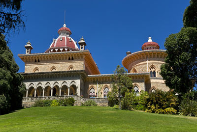 View of historic building against clear blue sky