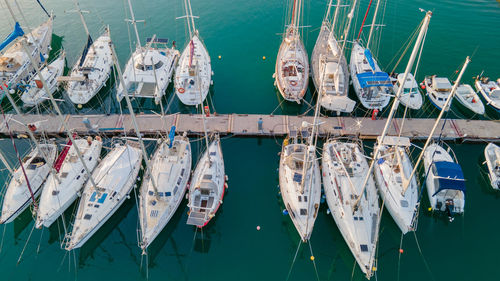 High angle view of fishing boats moored at harbor