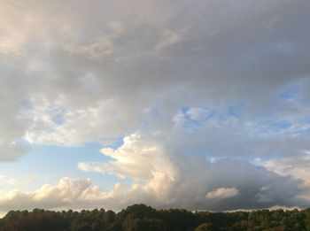 Scenic view of landscape against cloudy sky