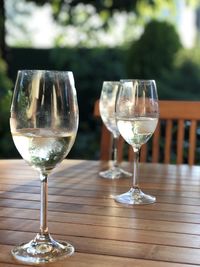 Close-up of wine glasses on table