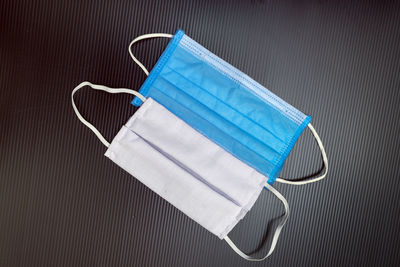 High angle view of blue pen on black background