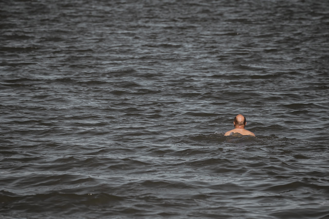 WOMAN SWIMMING IN SEA