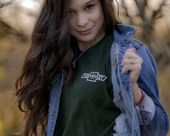 Portrait of woman wearing denim jacket