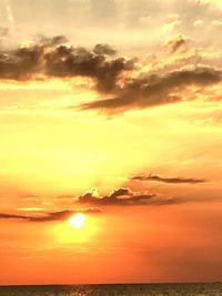Scenic view of dramatic sky over sea during sunset