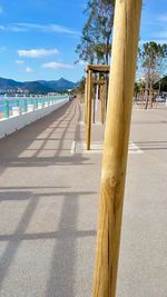 Railing by sea against sky