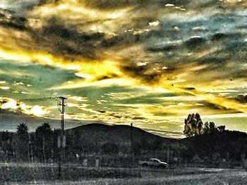 Scenic view of landscape against cloudy sky