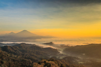 Scenic view of mountains against sky during sunset