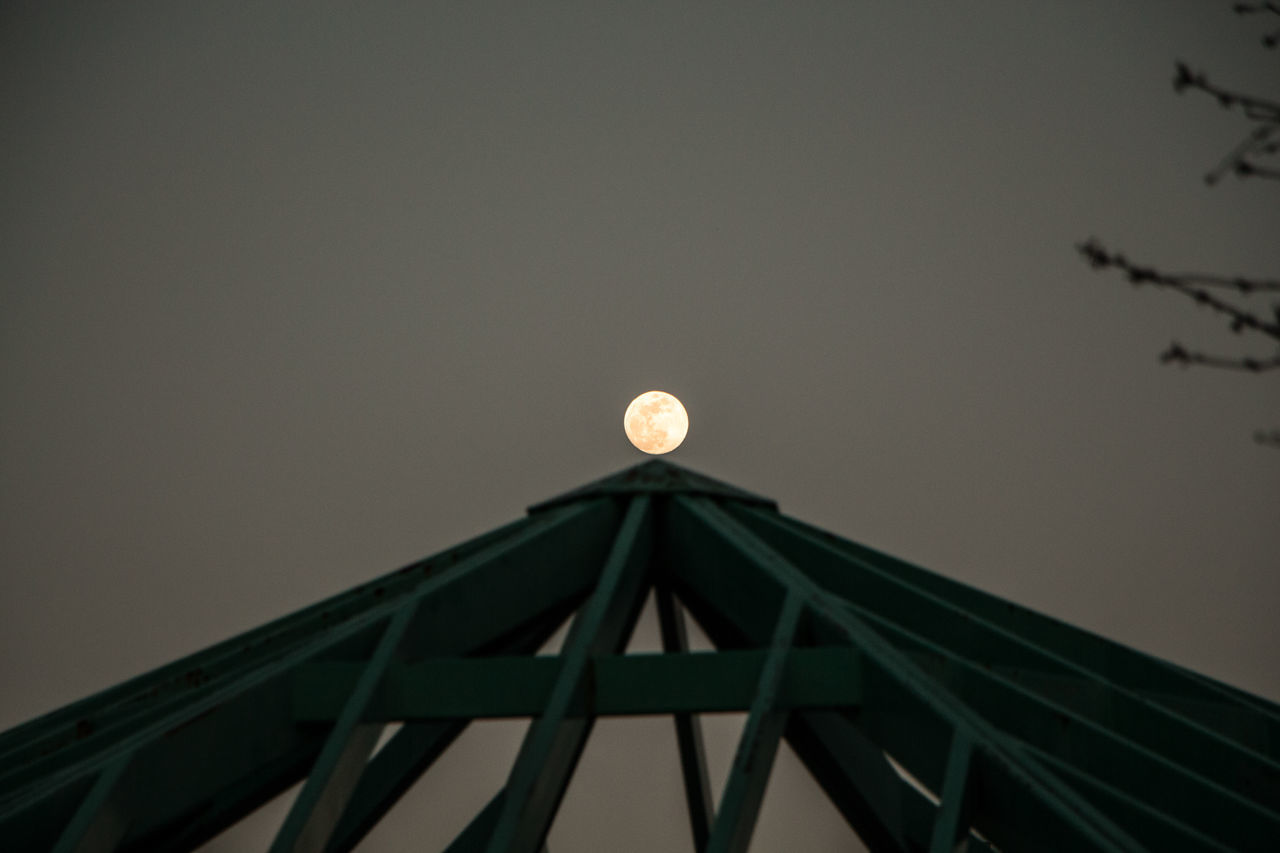 low angle view, built structure, illuminated, no people, architecture, sky, moon, building exterior, night, outdoors, nature, astronomy, solar eclipse