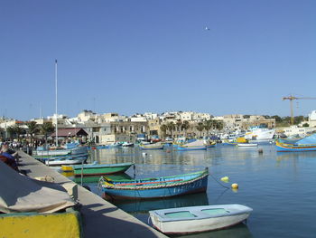 Boats moored in harbor