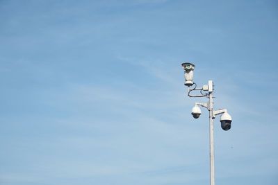 Low angle view of street light against sky