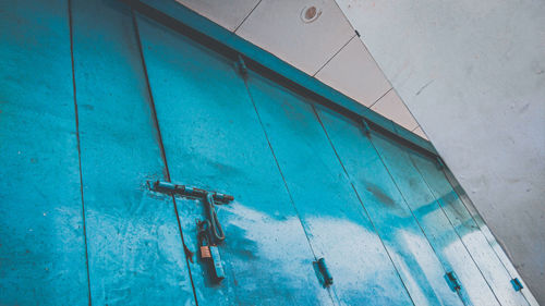 Low angle view of metallic structure on wall of building