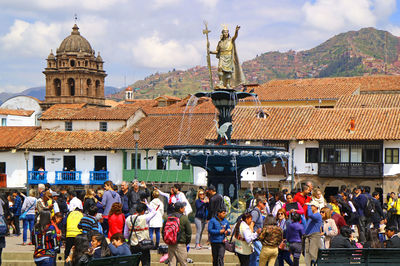 Plaza de armas in cusco with a fountain of pachacuti, the emperor of the inca empire, peru