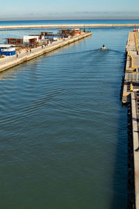 High angle view of harbor by sea against sky