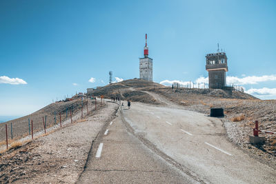 Low angle view of built structure on hill against sky