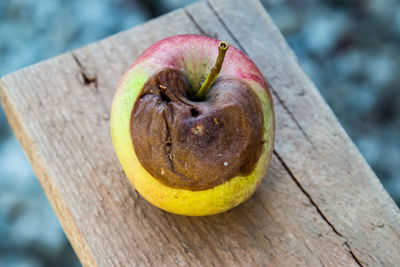 Close-up of apple on wood